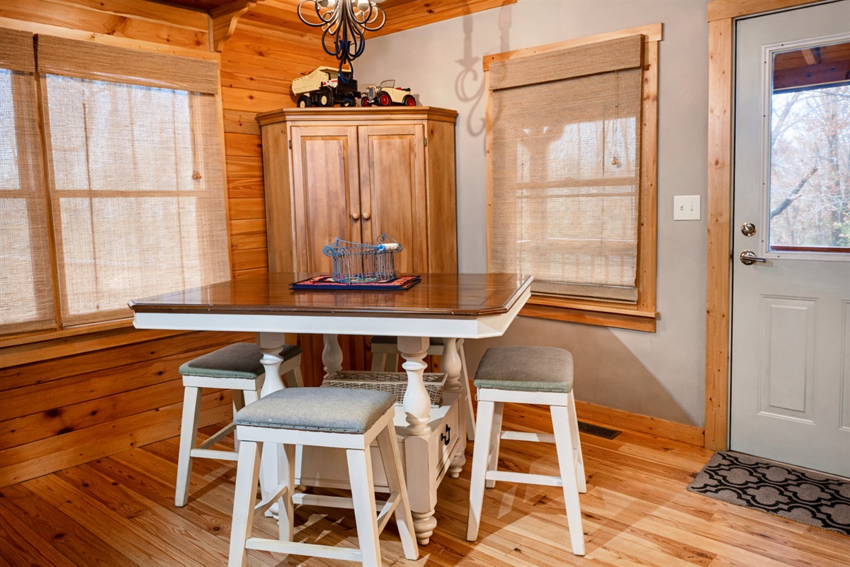 Gather around the cozy cabin dining table—perfect for morning coffee, family meals, and planning your next mountain adventure