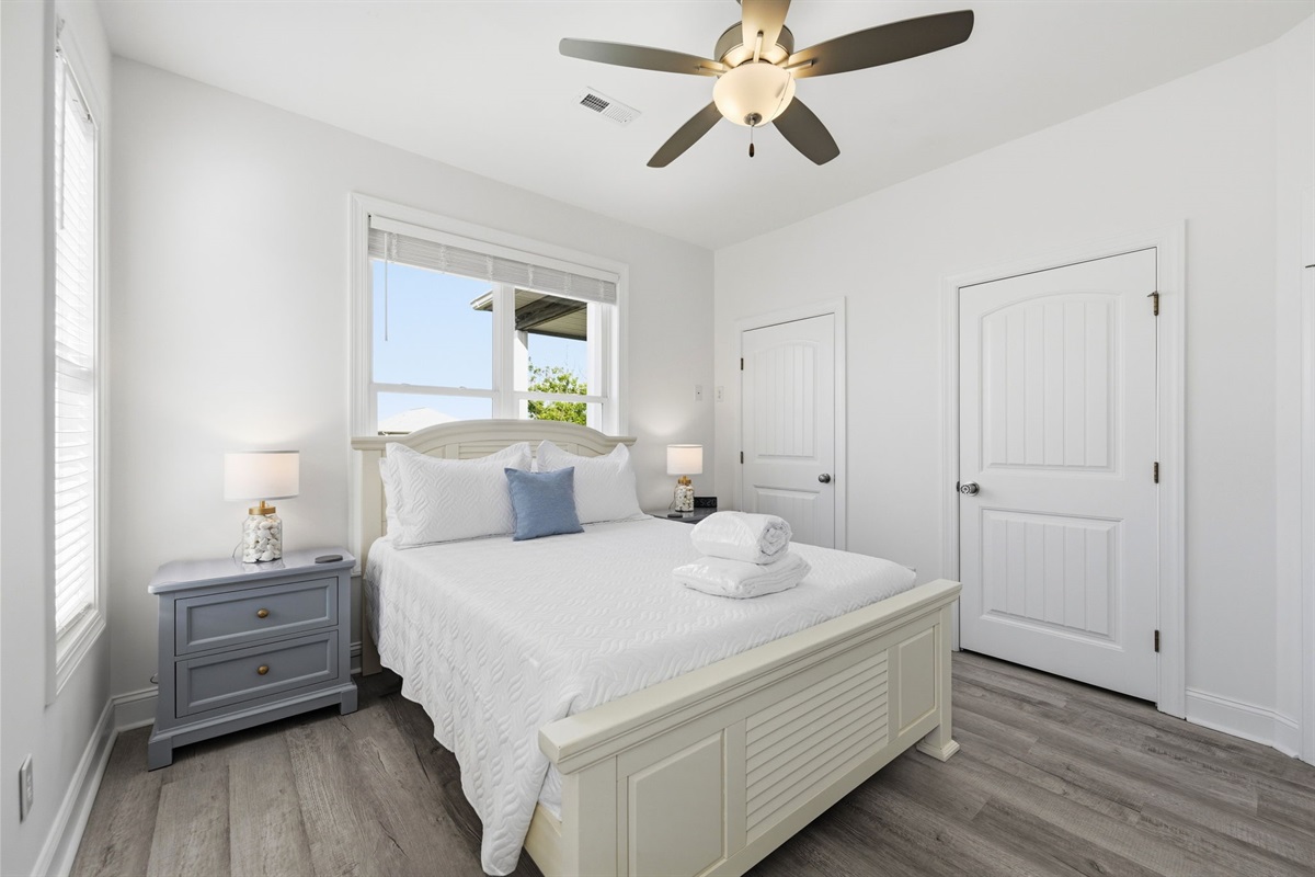 Soft coastal tones and comfy bedding make winding down effortless