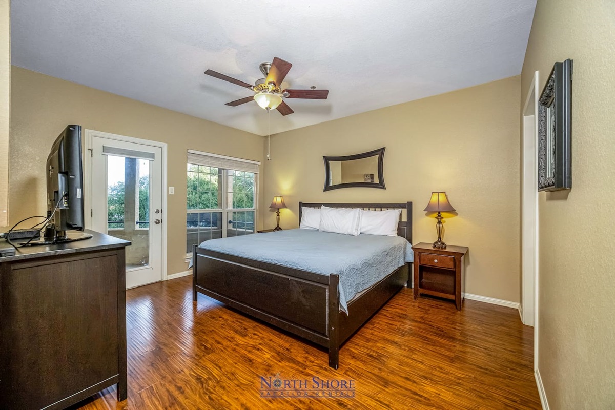 King bed in Primary Bedroom with En Suite Bath & Patio Access