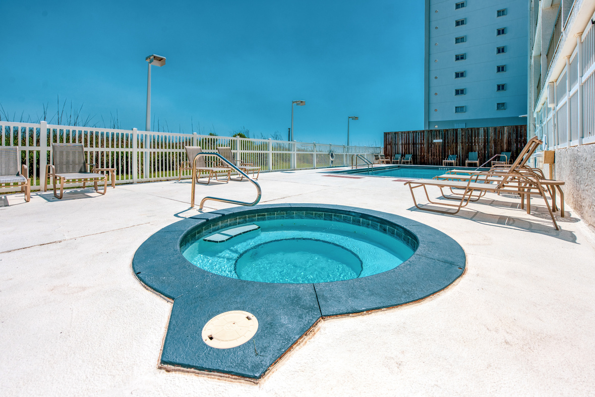 Shared outdoor hot tub on the building’s pool deck.