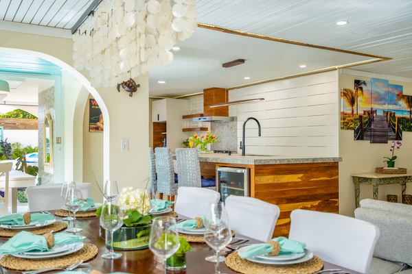 This view features the dinning room table looking across to the Island and the kitchen in Dorado, Puerto Rico.