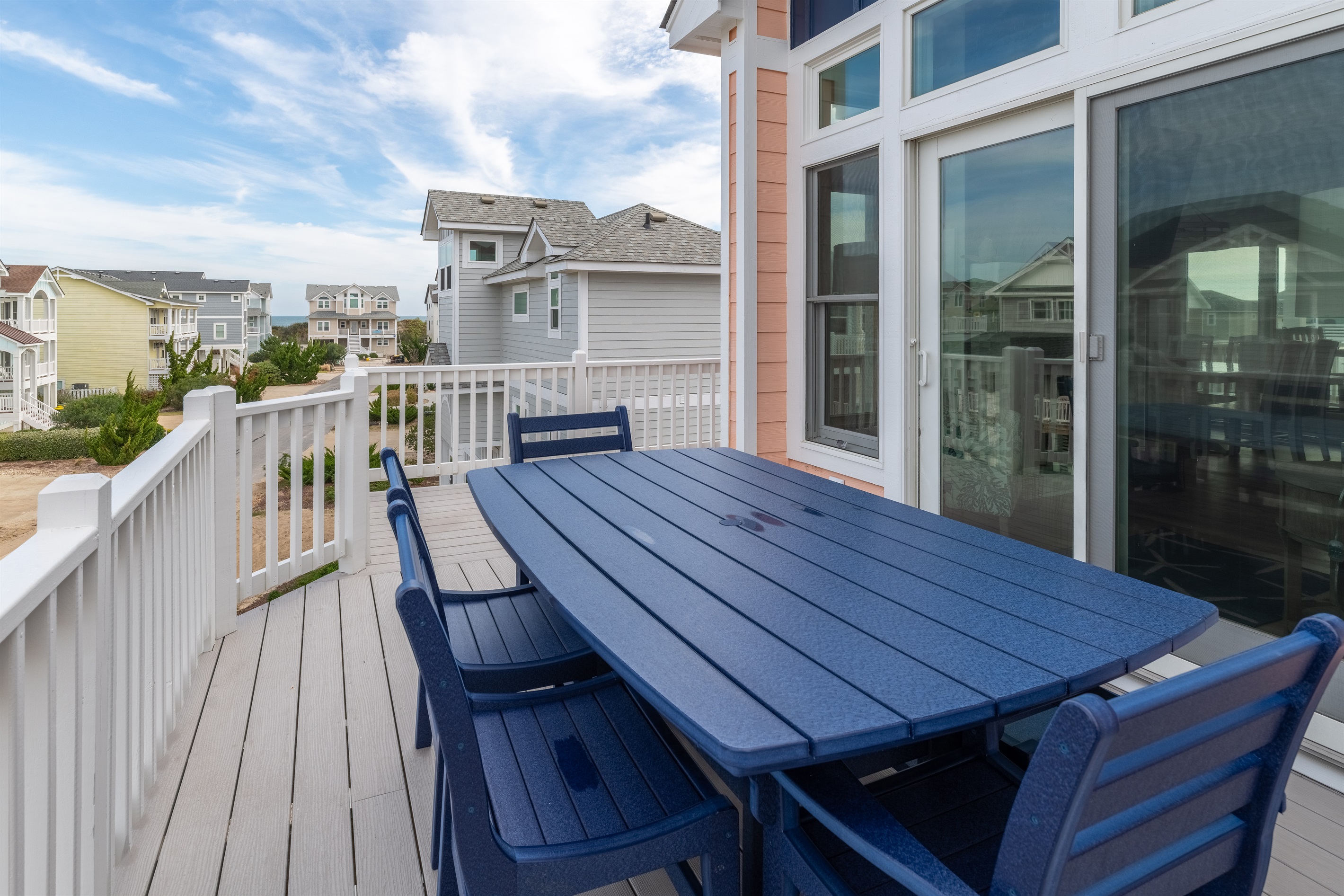 Deck with peek-a-boo ocean views off of living room