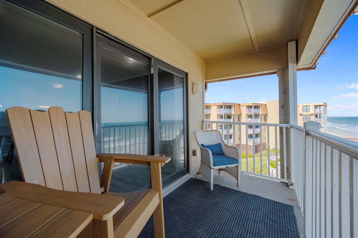 Corner balcony perspective offering both beachfront and coastal building views