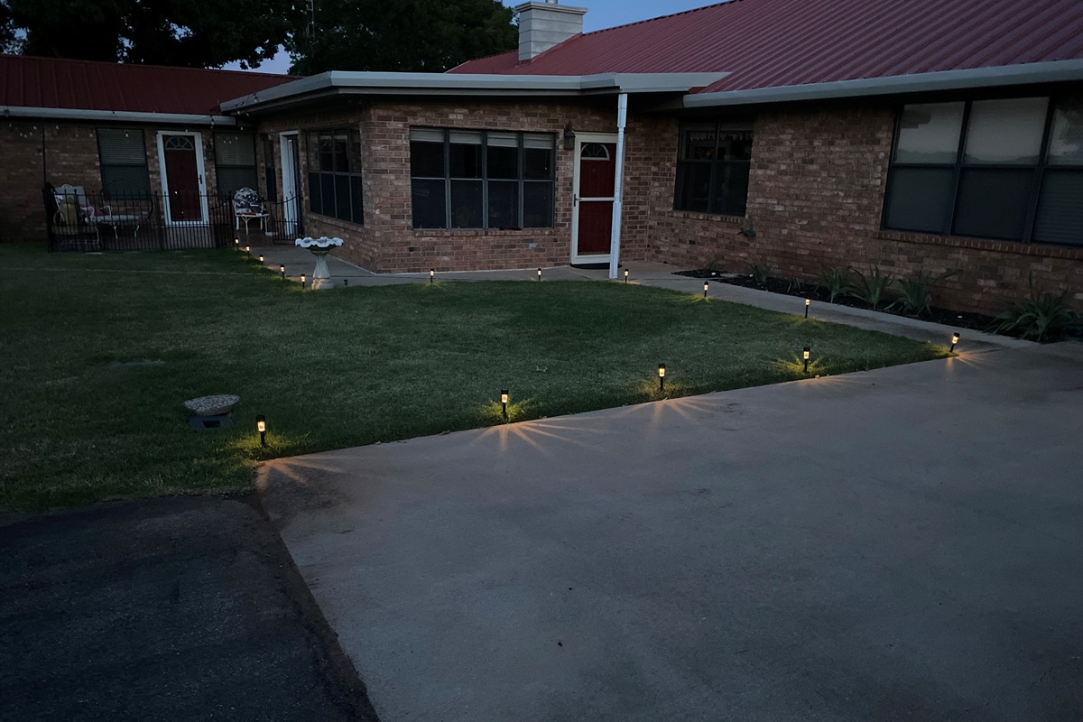 Keep following the lights from the parking area around the corner to the Apartment entry