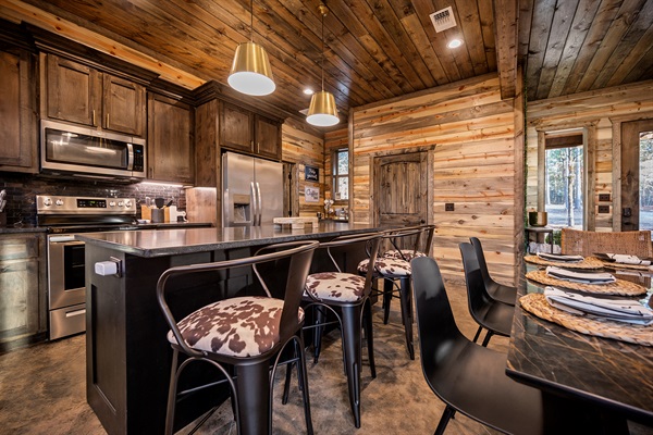 Rustic charm meets modern convenience in this fully equipped kitchen.