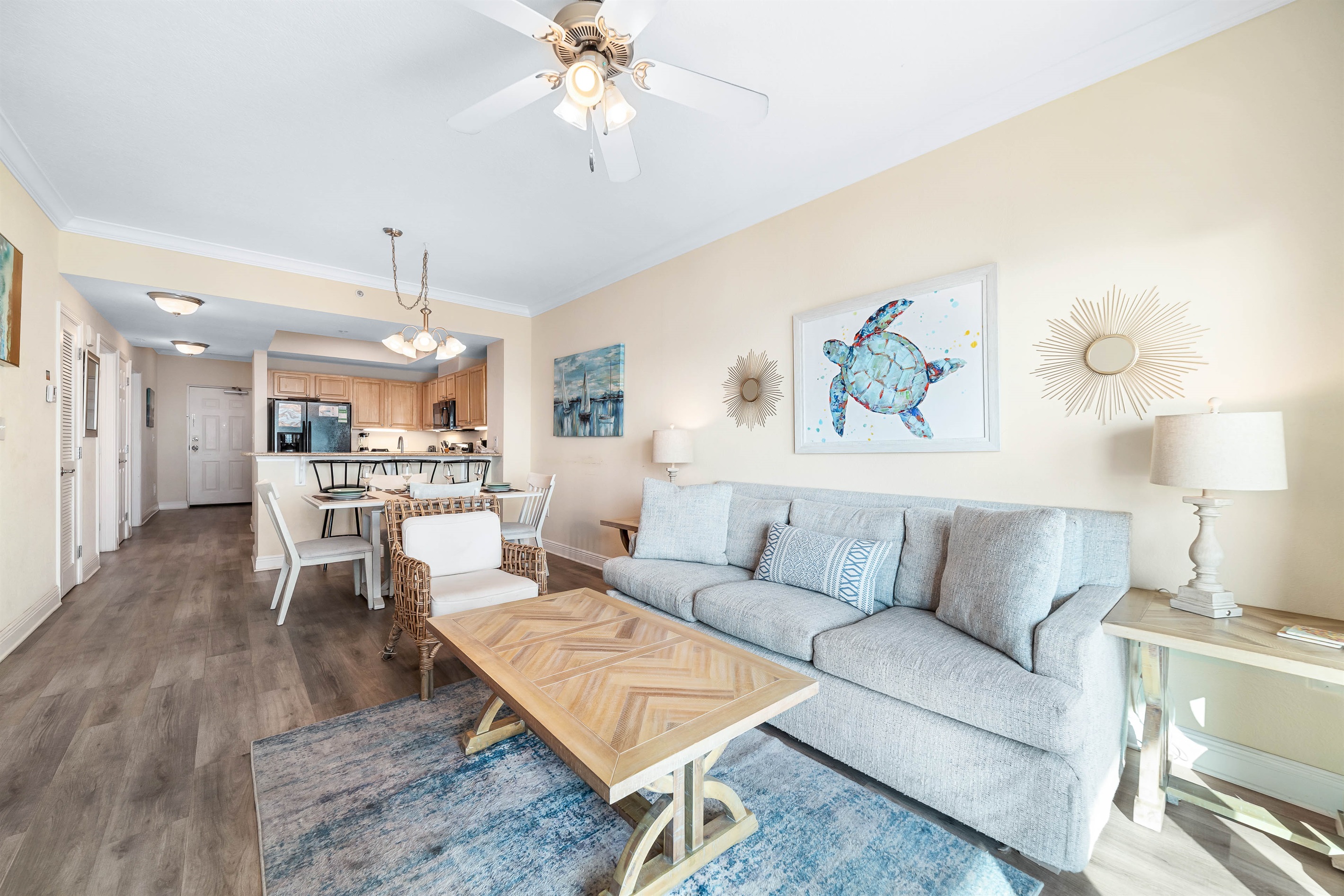 Light and airy living space featuring coastal-inspired decor and a seamless flow between the living and dining areas.