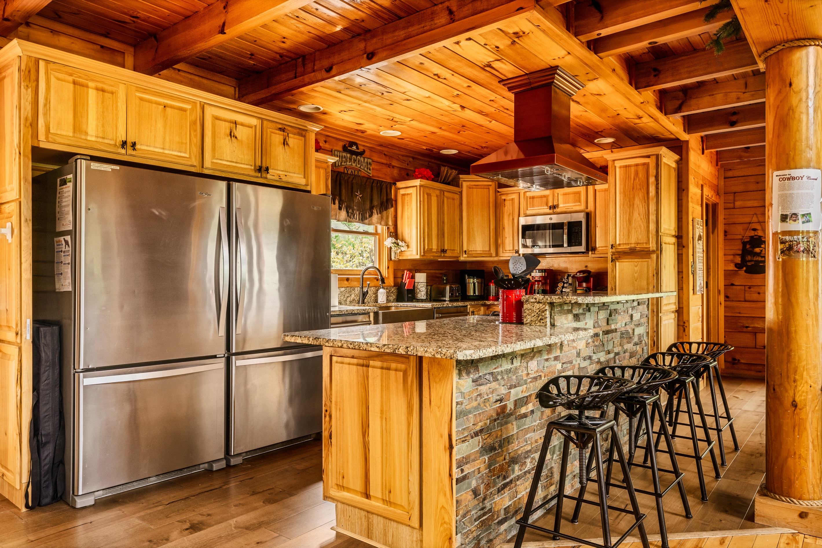 Remodeled kitchen with double fridge, 5 burner gas stove, farm sink and granite counters!