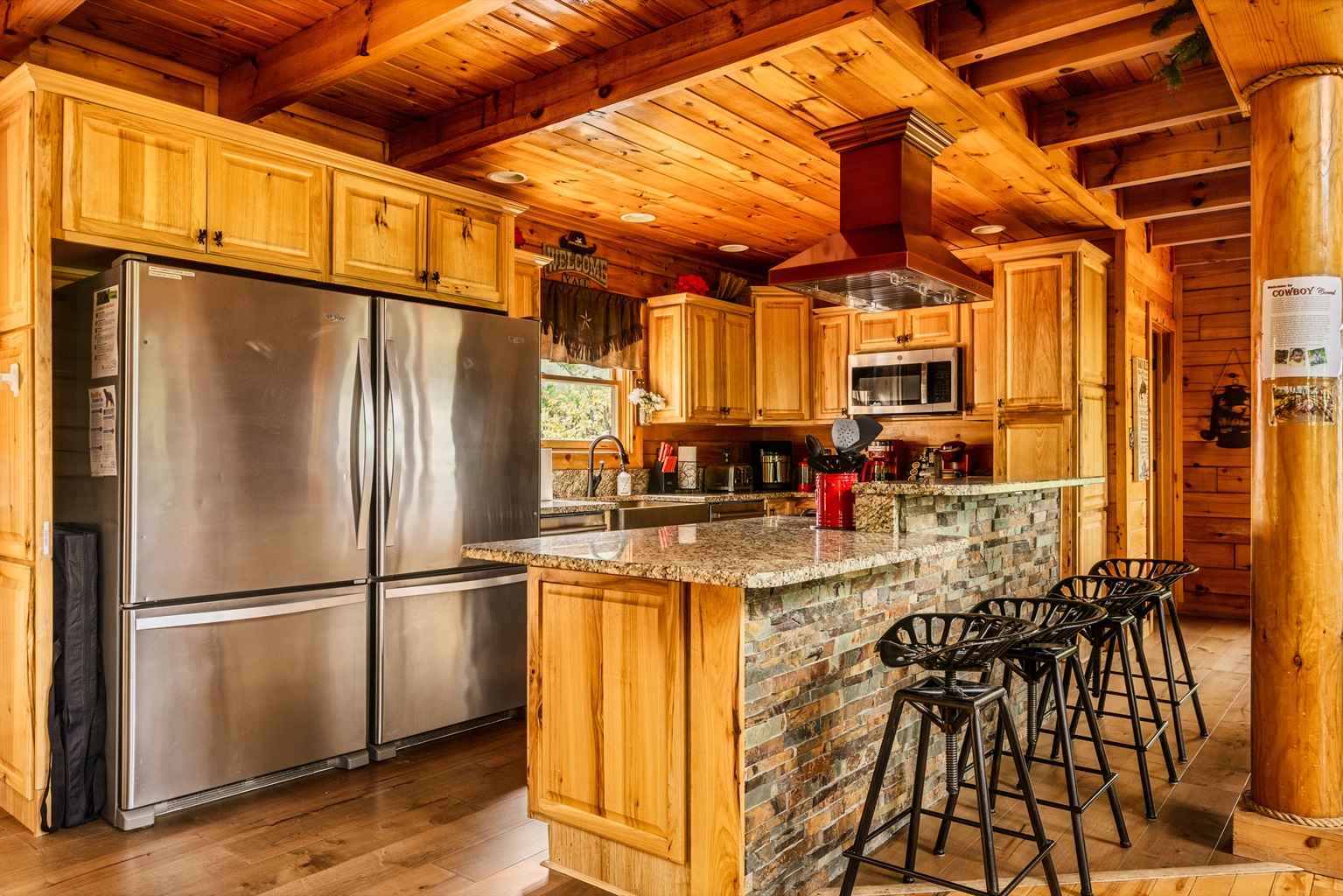 Remodeled kitchen with double fridge, 5 burner gas stove, farm sink and granite counters!