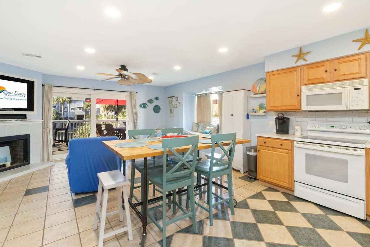 Your sightline from the kitchen stretches right into the living area &mdash; stay connected to the group while you cook.	