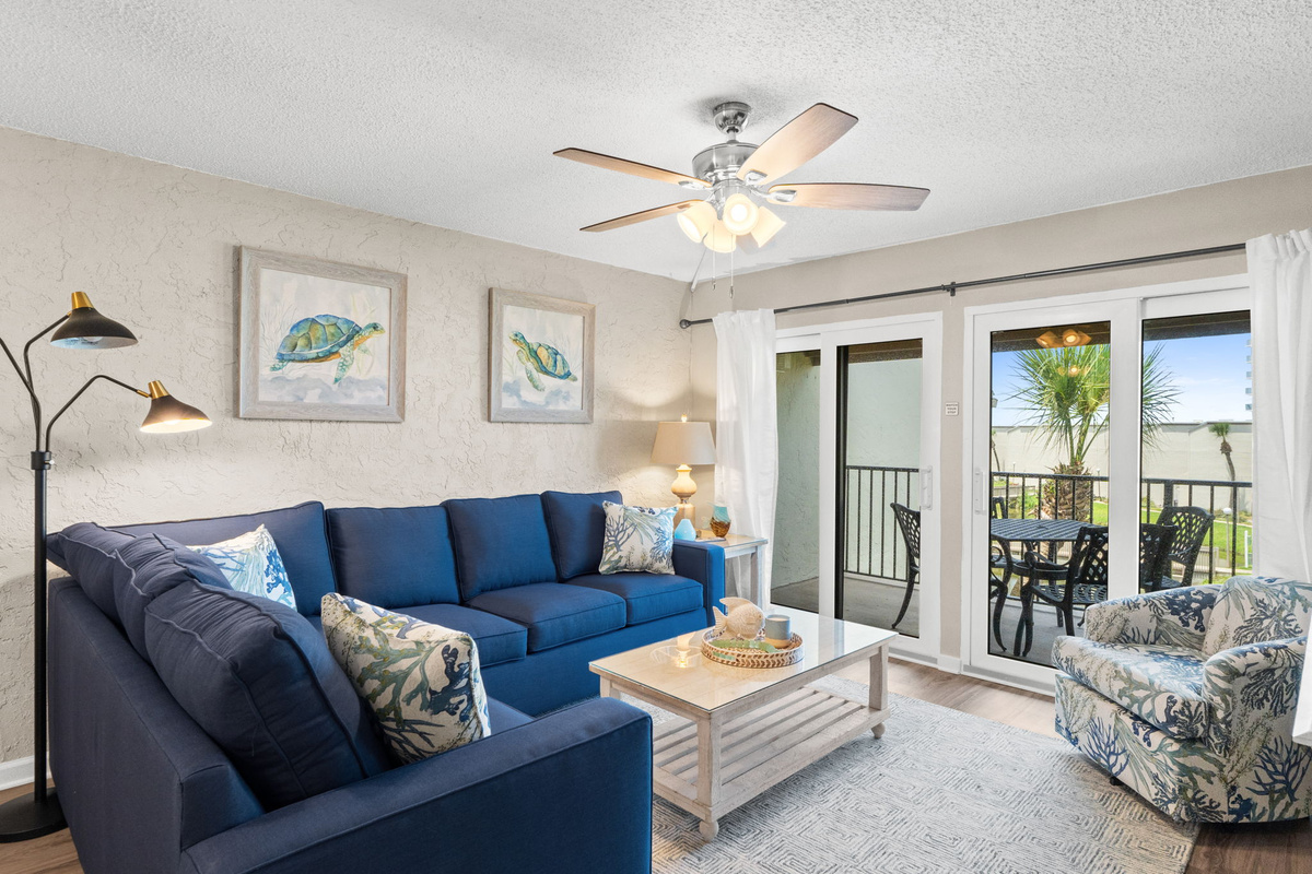 Living Room with Queen Sized Sleeper Sofa and Balcony Access