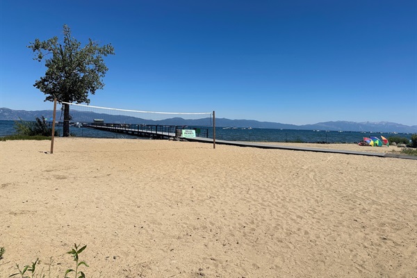 Private beach and volleyball court next to the pier.