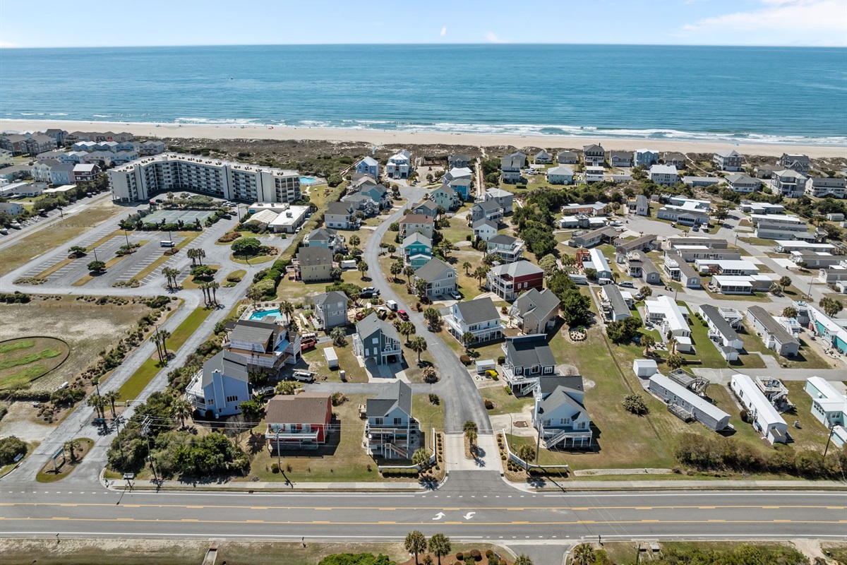 Aerial view showing the home&rsquo;s location just a short walk from the beach and close to the community pool