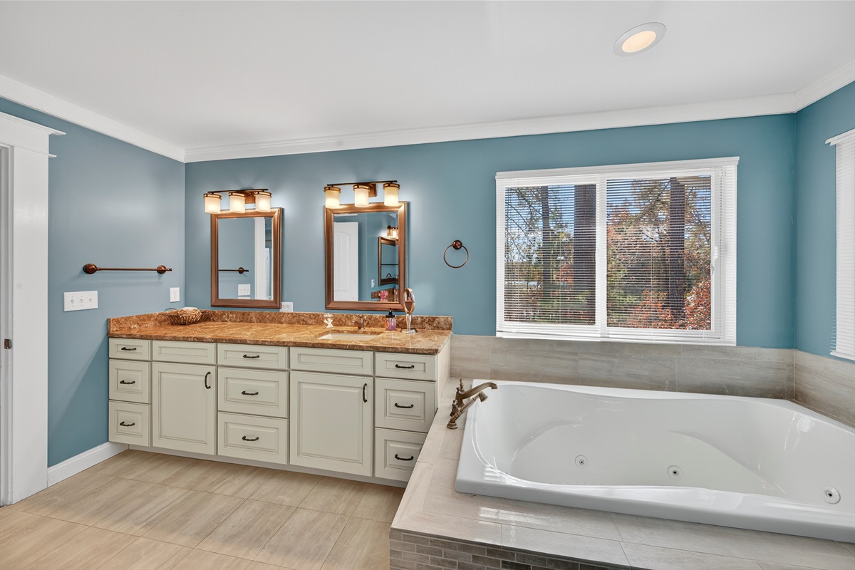 Bright, beautiful bathroom with calming lake-inspired colors.