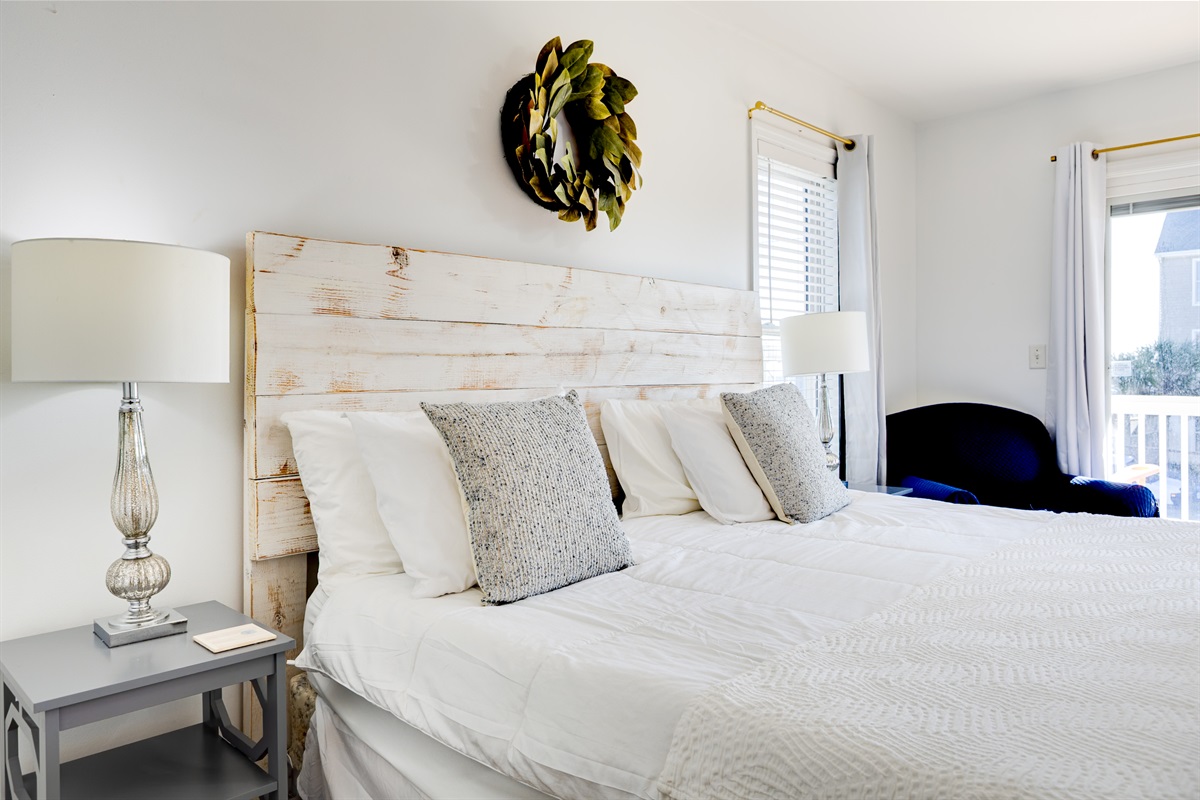 Serene, sunlit master bedroom with a cozy coastal feel&mdash;perfect for restful nights and slow mornings
