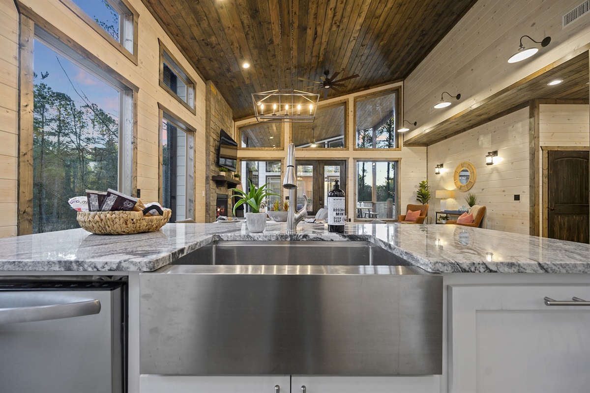 Sunlight dances across marble counters and warm wood tones, setting the scene for effortless meals and connection.