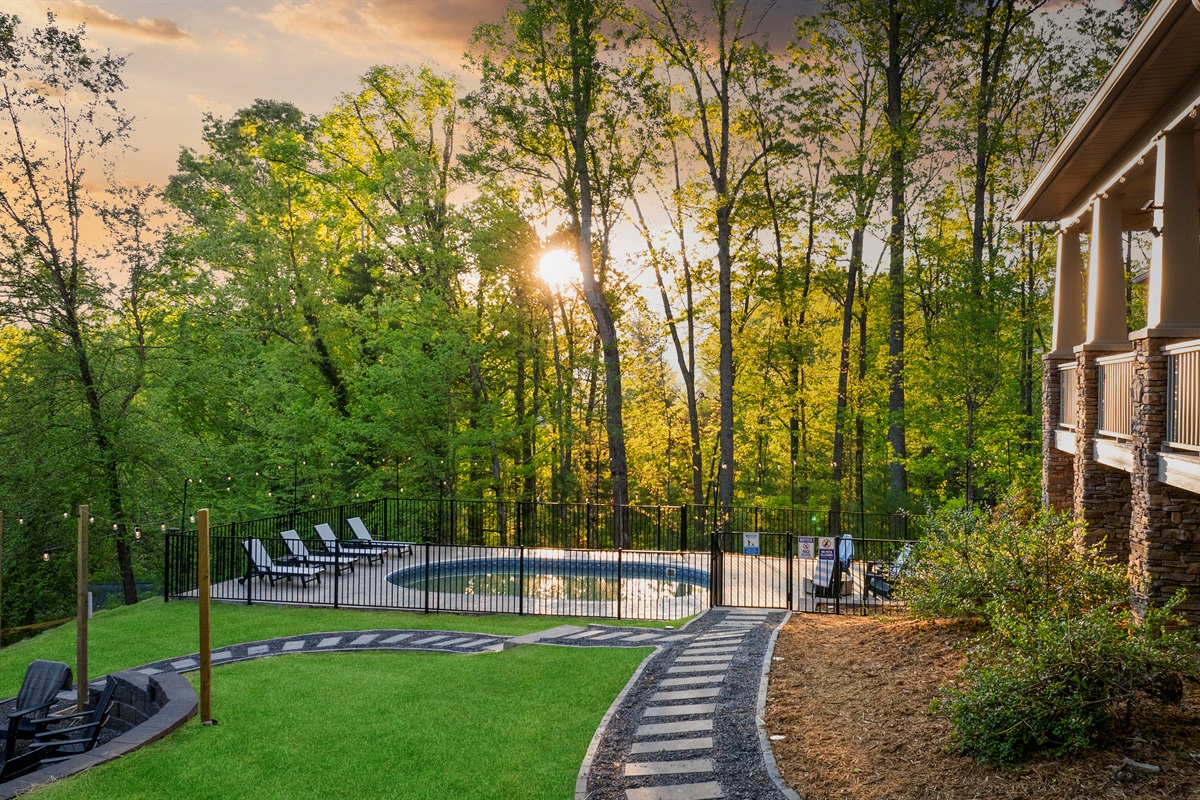 Evenings shine at Timberline Retreat. Whether you're lounging by the poolside fire table or sipping wine on the porch, golden hour hits differently in the middle of the woods.