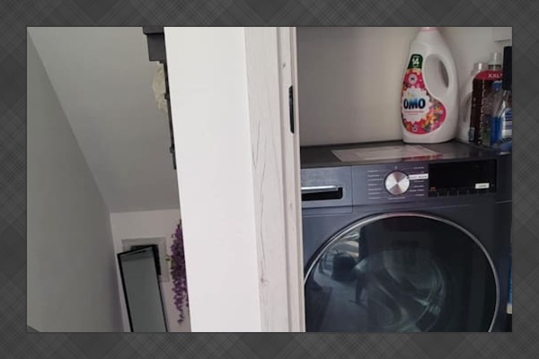 Full size washing machine in the common area shared with downstairs apartment
