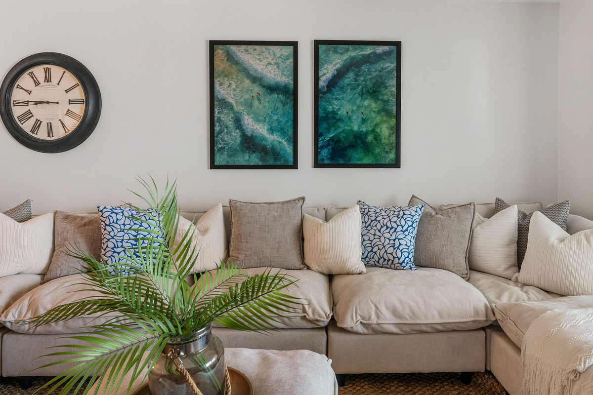 Custom accents like super cozy pillows, throw blankets and pretty greens make this a spot you will never want to leave.