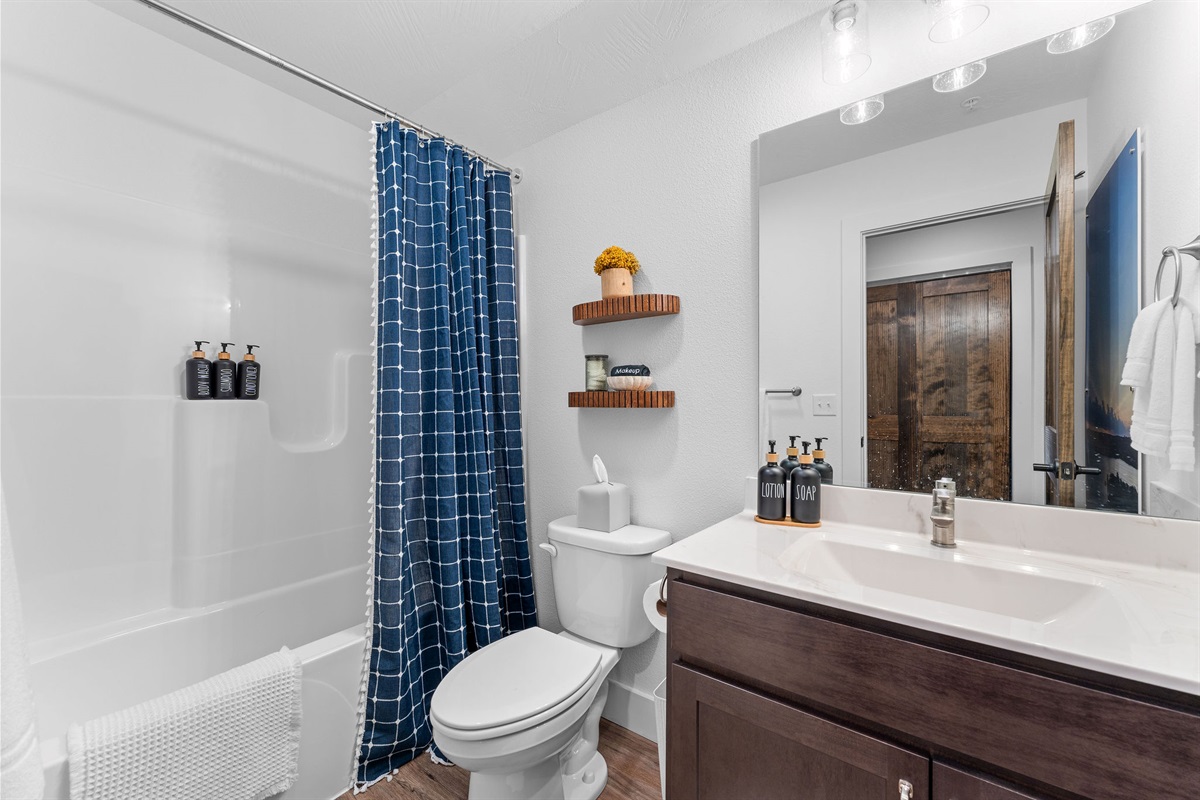 The Top of the Rock bathroom with tub and shower combo. 