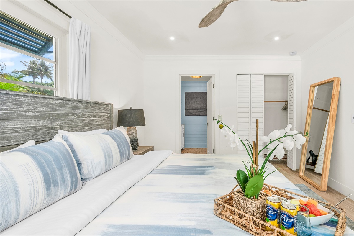 Primary Suite: King-size Tempur-Pedic Pro Adapt mattress, en-suite bath with dual-sink vanity. Pool views. 