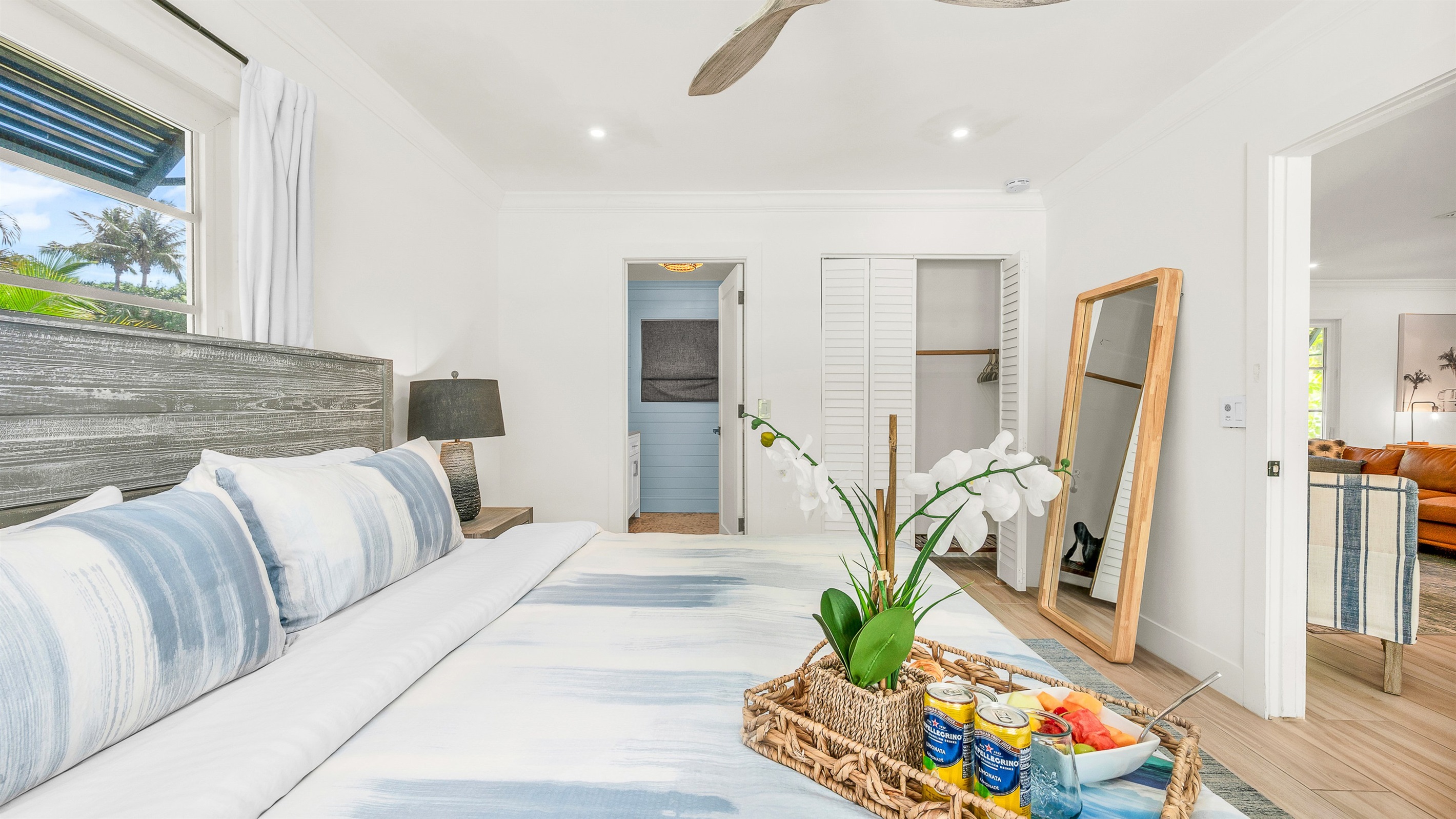 Primary Suite: King-size Tempur-Pedic Pro Adapt mattress, en-suite bath with dual-sink vanity. Pool views. 