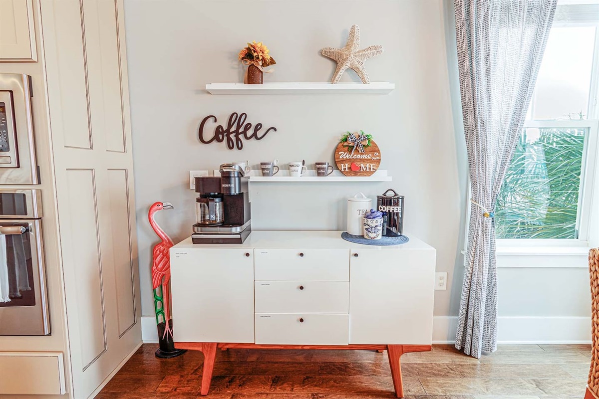 Coffee bar with complementary coffee pods, tea, hot chocolate, sugar, and creamer
