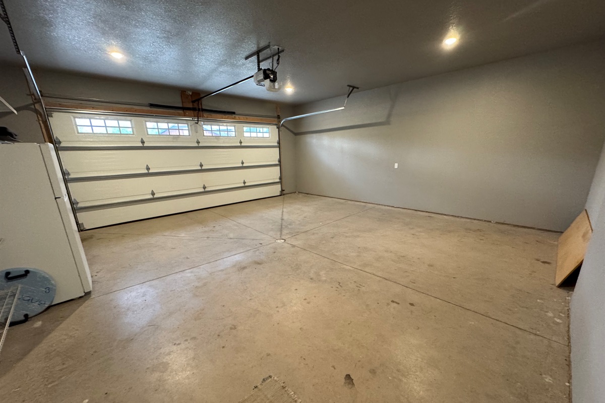 Park inside or store your gear in this spacious garage—complete with overhead doors, bright lighting, and a bonus fridge for extra drinks or overflow food.