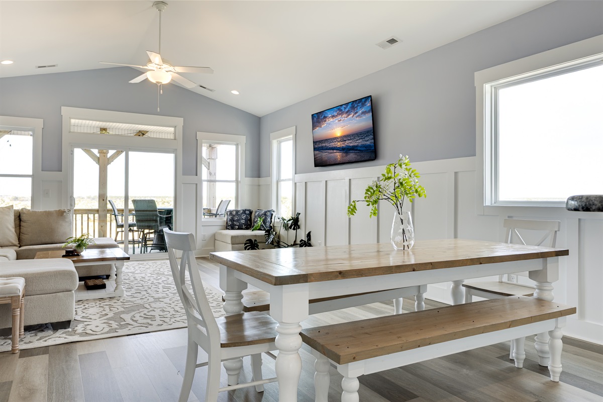 A spacious dining table ready for family dinners, game nights, or beach-day planning