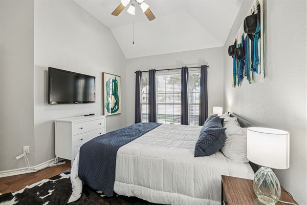 Cozy room with ample light and a 40” Apple TV for easy streaming.