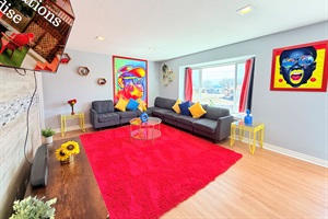 Retreat to the comfort of our living area, enhanced with the cinematic allure of Roku TV for a blissful escape.