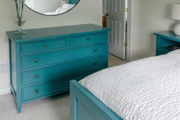 Large dresser available for guests next to the primary bathroom. 