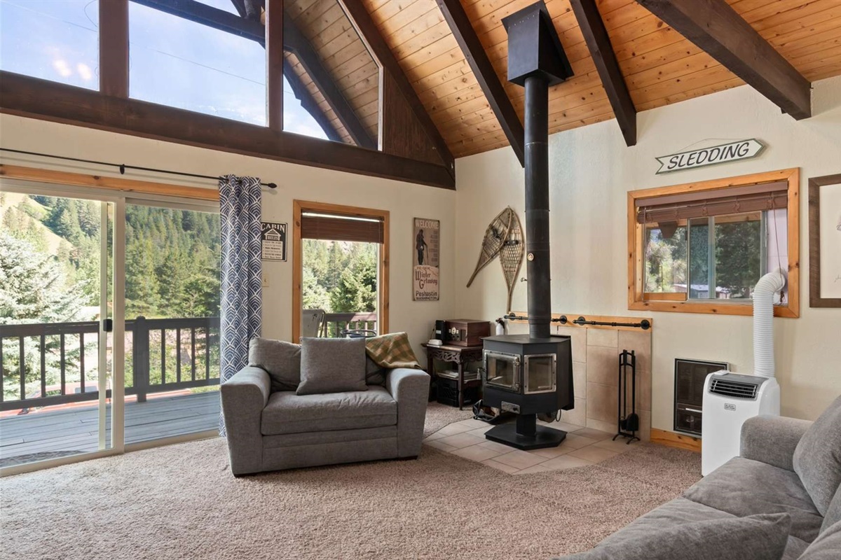 Enjoy the comfort of a cozy woodstove in the living area.