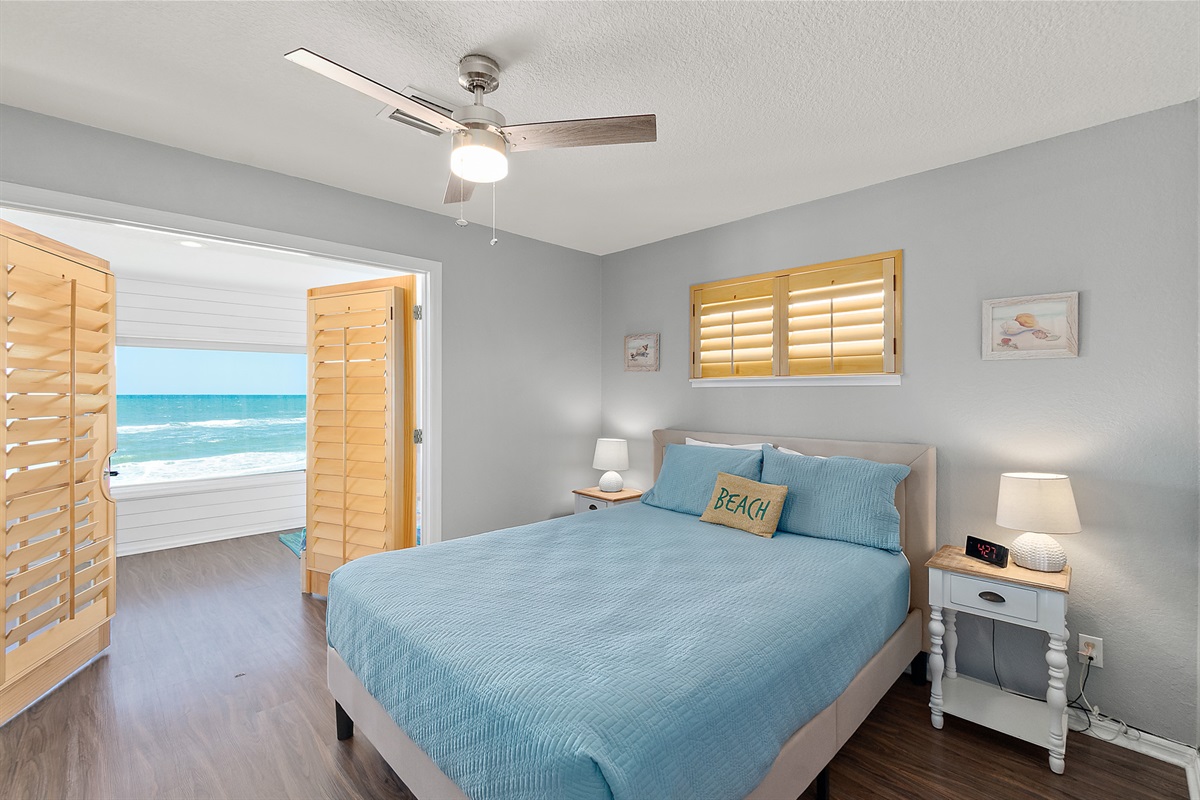 Guest bedroom with ocean views and natural light