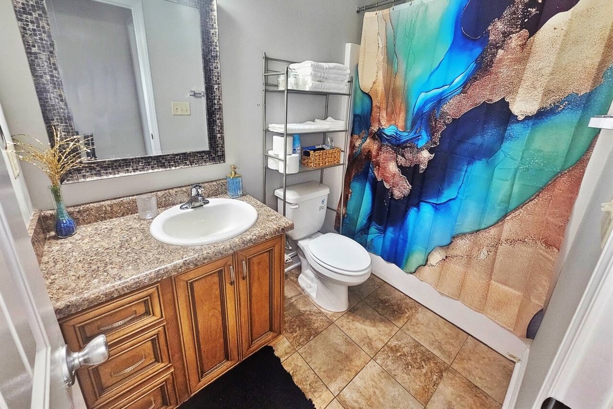 Full-sized bathroom located in the hall.  It contains all your necessities and a little extra. 