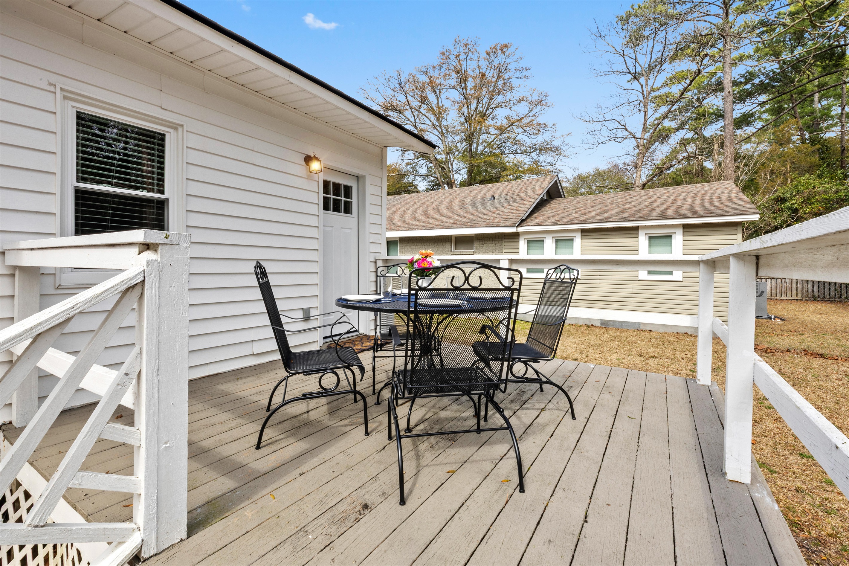 The back deck has seating for 4 around the patio table