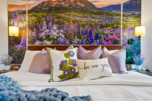Another main bedroom wraps you in the soft hues of a spring wildflower field in bloom.
