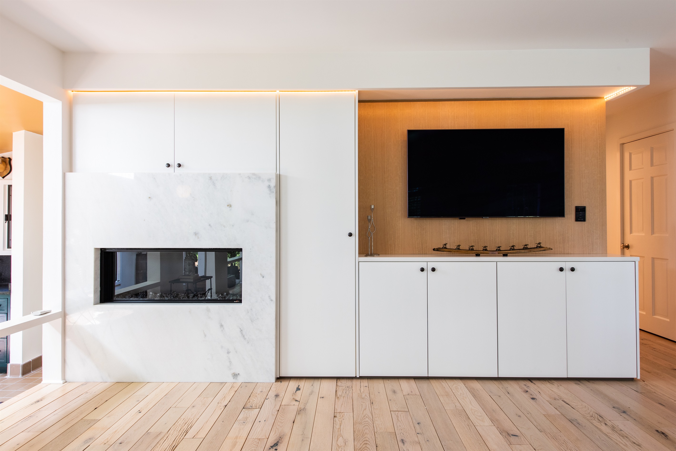 Cozy fireplace with a mounted TV, creating a warm hub for relaxation and entertainment.