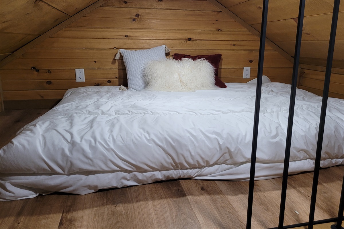 Comfortable bed in the sleeping loft; comfort in compact space