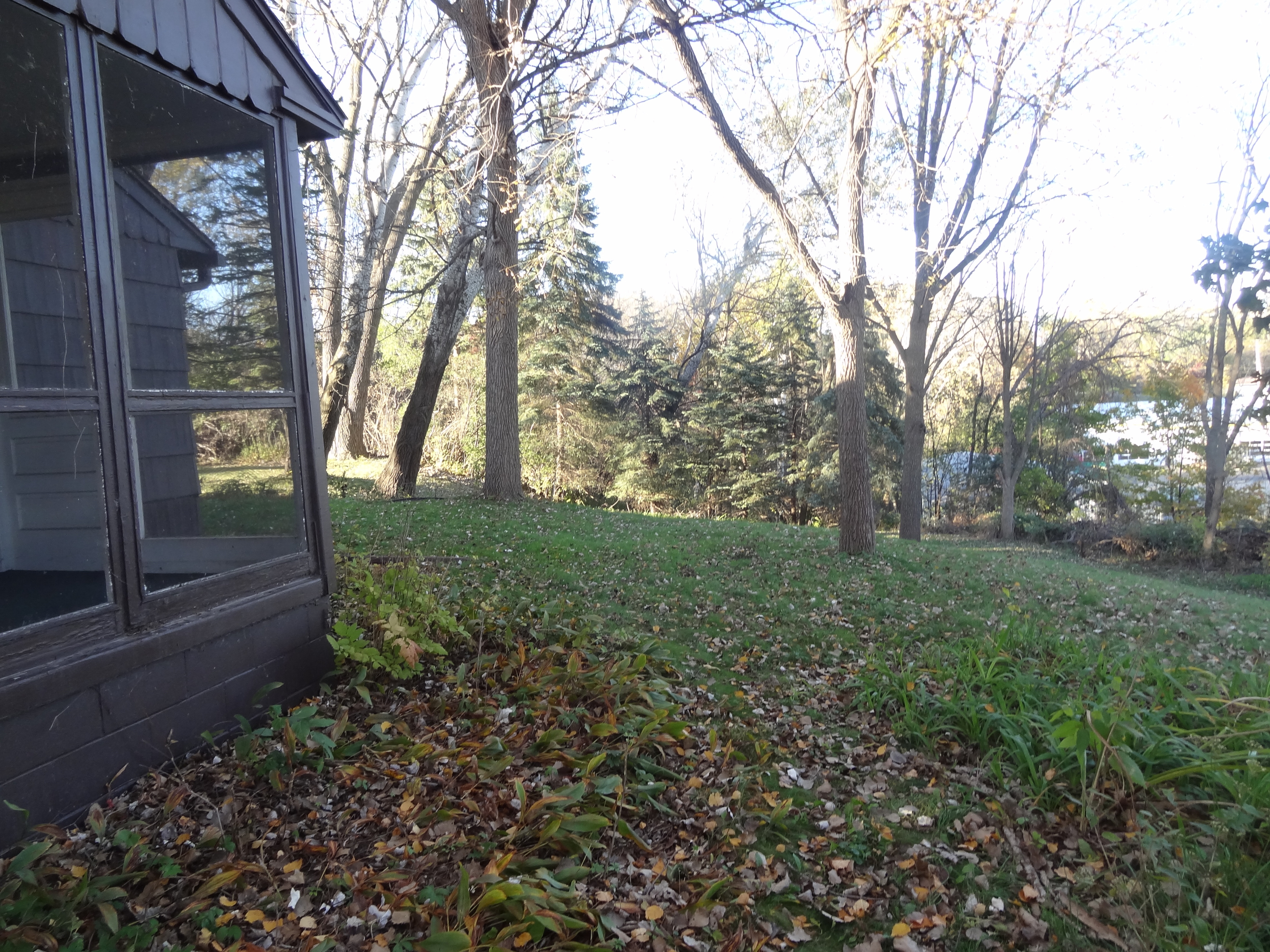 Three season porch off of living room with access to backyard