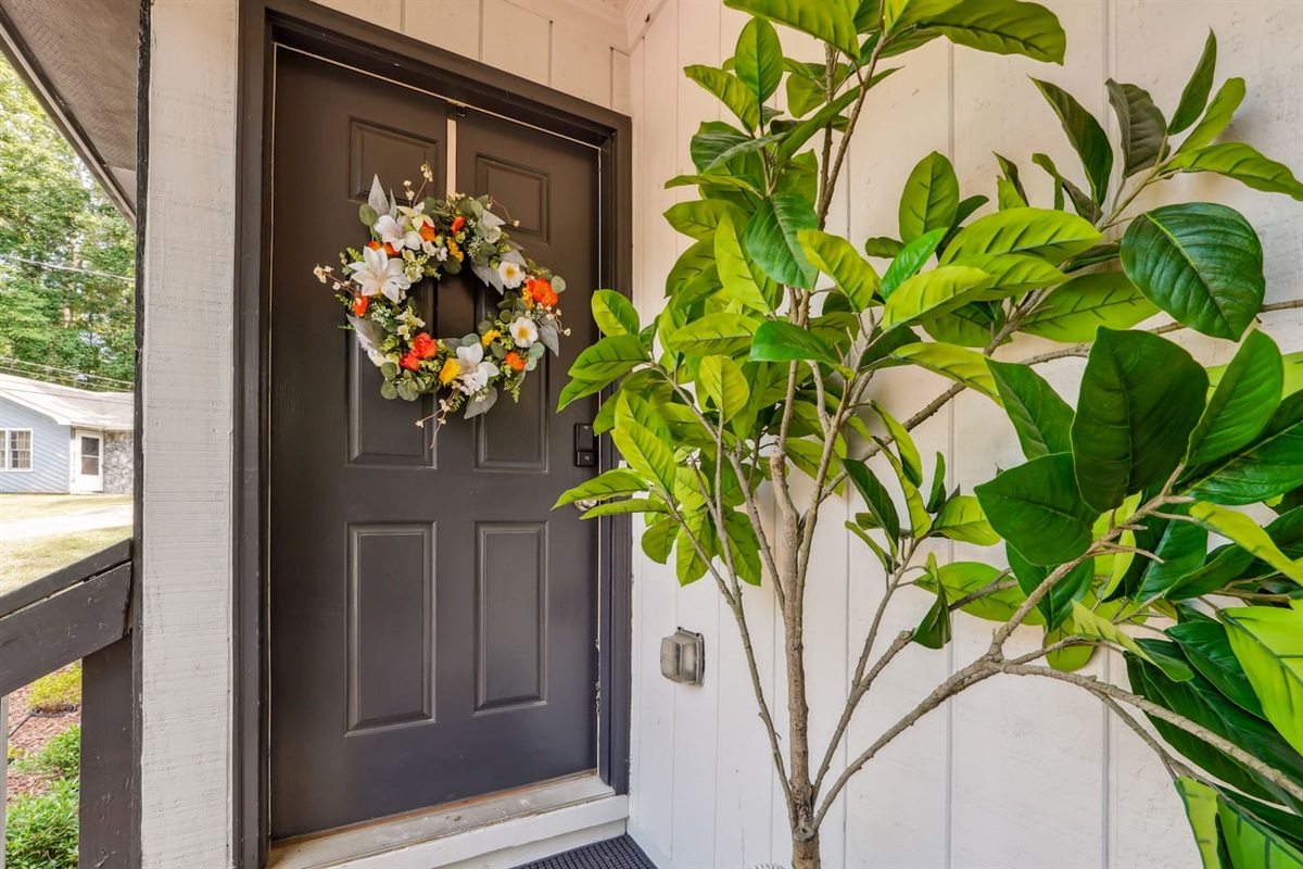 The exterior showcases our triplex property. Your unit, Unit A, is located on the far left side with easy access using our Eufy powered smart lock.