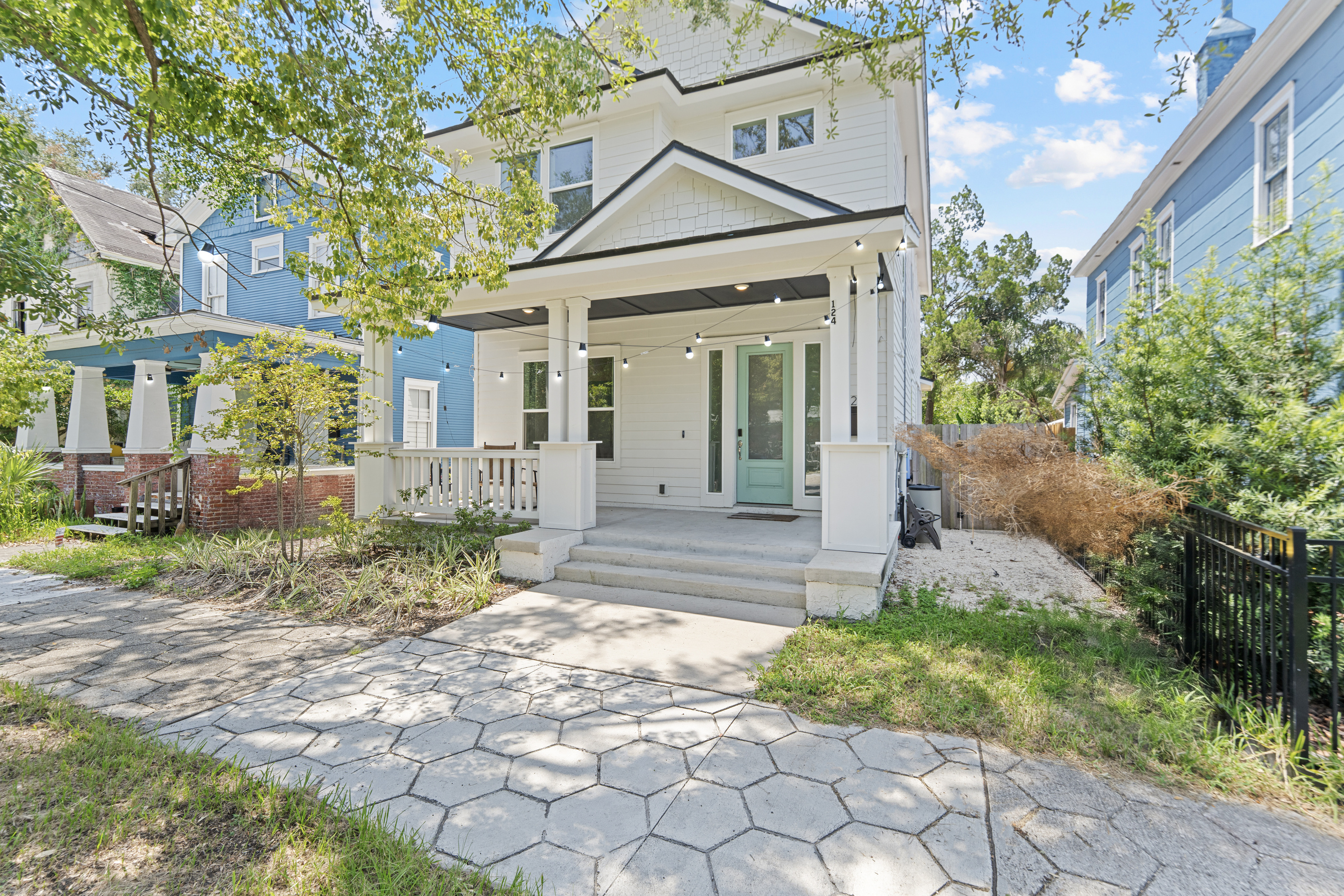 The porch light is on and the front door is that perfect shade of mint. Climb the steps, drop the bags, and feel the whole week open up ahead of you. This classic Springfield charmer is your family's home base.