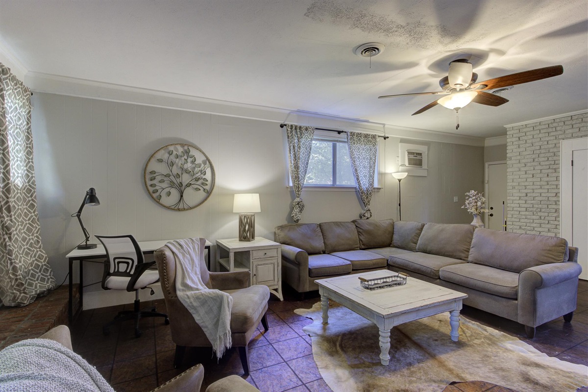 Spacious 2nd living room with desk, TV, and full size pull-out sofa bed