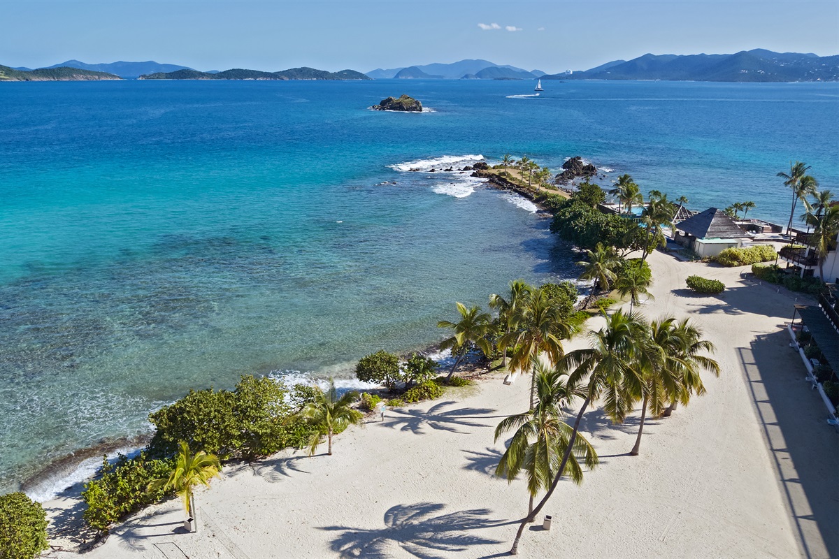 Breathtaking drone view of Sapphire Beach&rsquo;s turquoise waters and soft white sand.