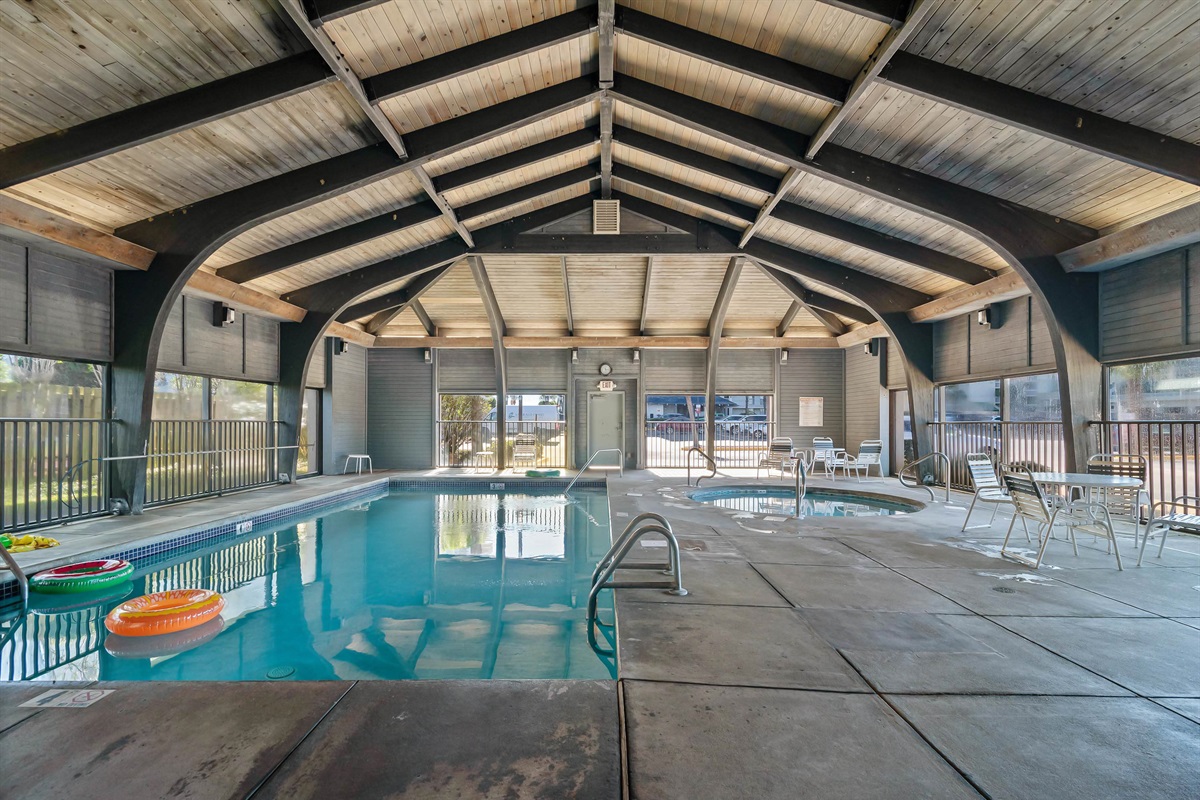 Serene waters, sophisticated setting. Immerse yourself in the tranquil ambiance of this beautifully designed private club house with indoor heated pool at Windward Pointe