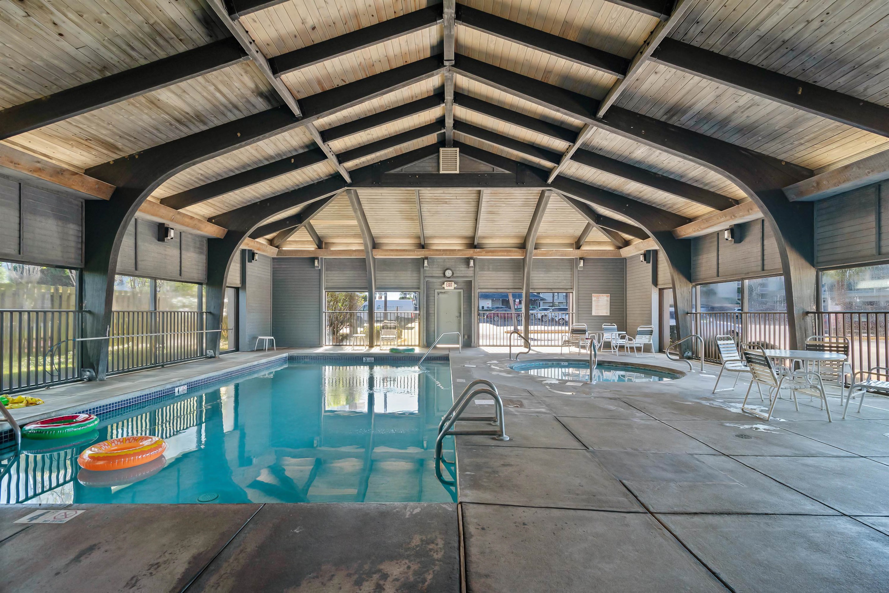 Serene waters, sophisticated setting. Immerse yourself in the tranquil ambiance of this beautifully designed private club house with indoor heated pool at Windward Pointe