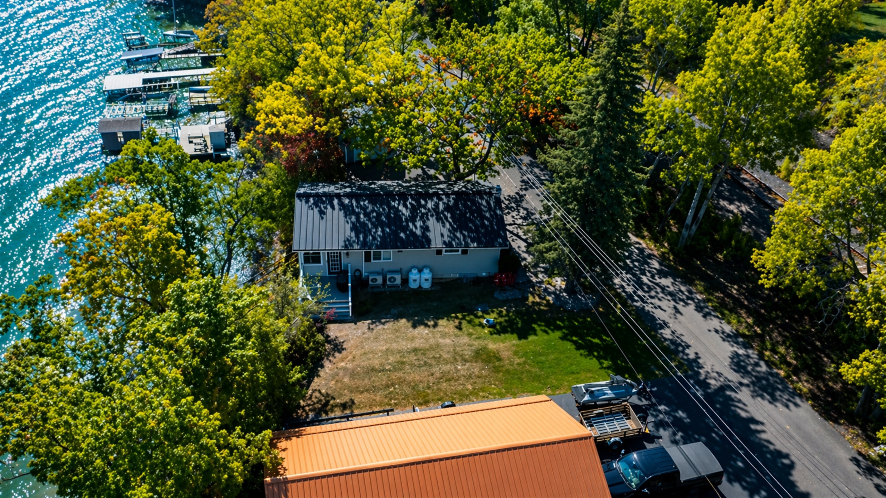 Scenic bird’s-eye view showcasing spacious grounds and peaceful wooded setting
