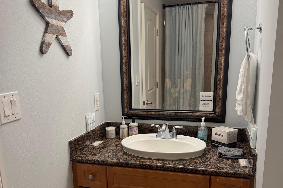 Third full bathroom with granite vanity and tub/shower combo—perfect for keeping everyone comfortable during busy beach mornings.