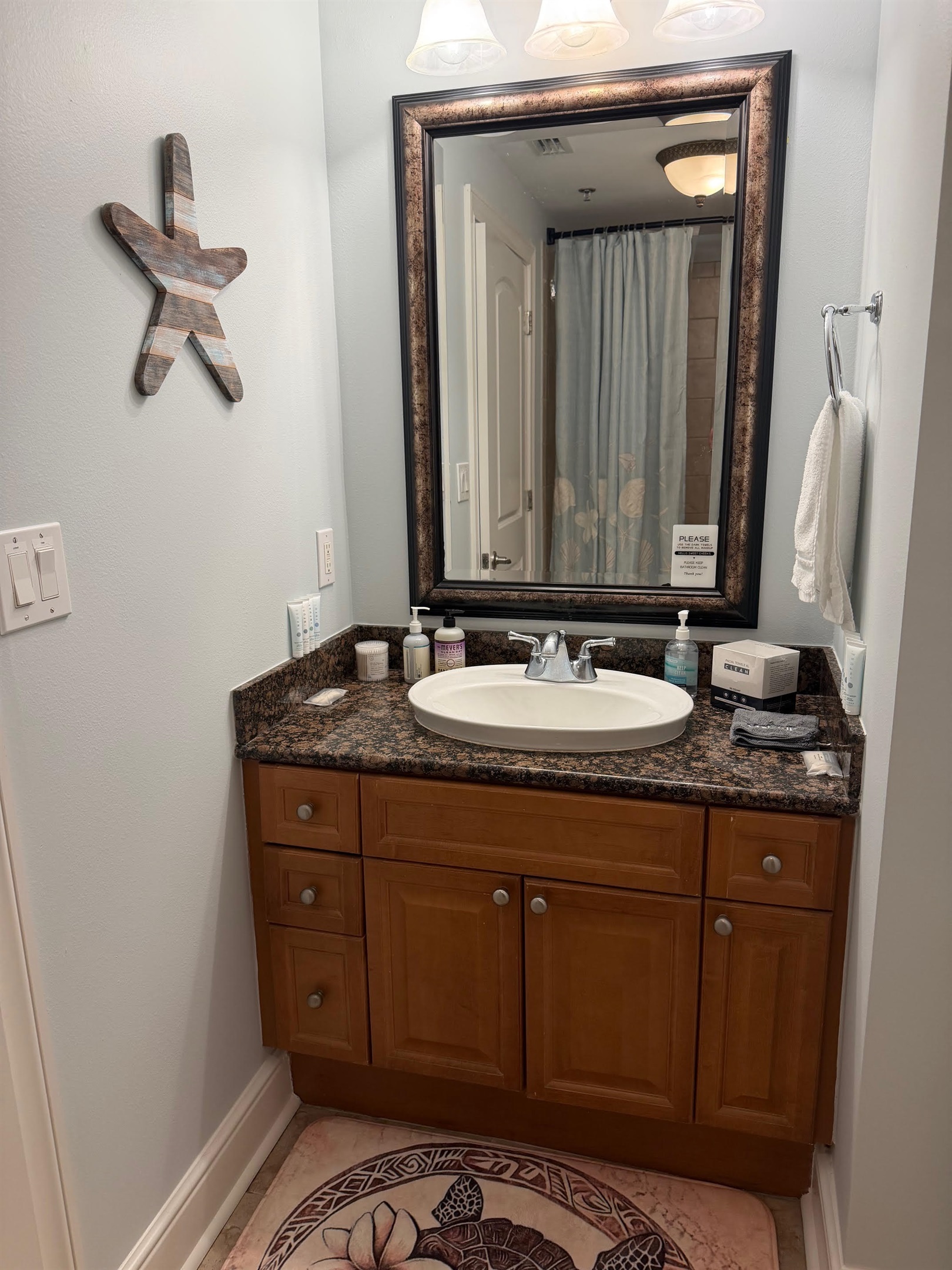 Third full bathroom with granite vanity and tub/shower combo—perfect for keeping everyone comfortable during busy beach mornings.