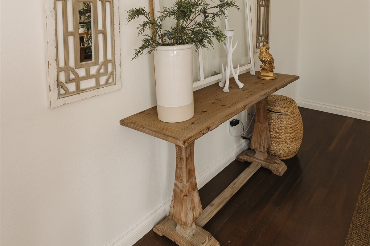 Warm, welcoming entry with curated décor and mountain charm. Attiwood Ridge offers a boutique Pinetop condo experience designed for couples and families seeking comfort, style, and a peaceful getaway.