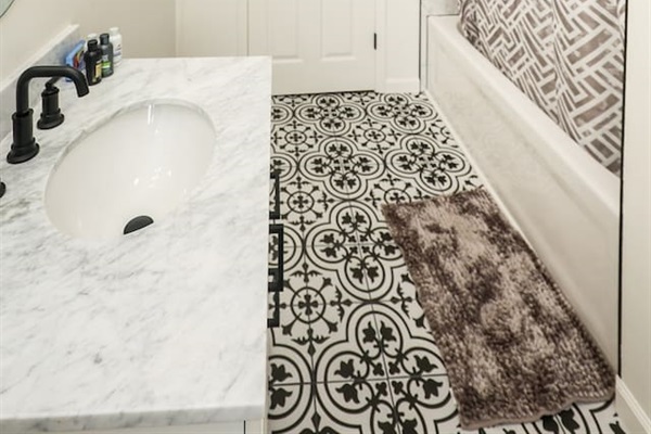 Full bathroom with a relaxing bathtub, perfect for unwinding and enjoying a soothing soak.